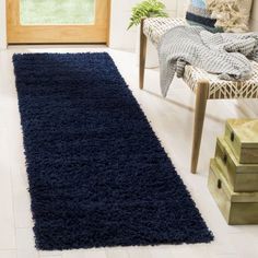 a blue rug is in the middle of a room