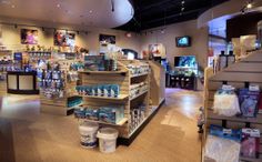 the inside of a store with shelves filled with products