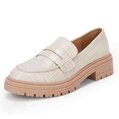 a woman's white loafer with chunky soles and an alligator skin pattern