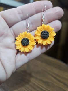 Beautiful yellow Sunflower earrings. Sunflower is approximately 1" round. Hope you enjoy! Yellow Round Sunflower Jewelry, Sunflower Design Dangle Earrings As Gift, Sunflower Design Dangle Earrings For Gift, Yellow Sunflower Design Dangle Earrings, Yellow Sunflower Dangle Earrings, Orange Flower-shaped Adjustable Earrings, Yellow Sunflower Design Jewelry Gift, Yellow Jewelry With Matching Earrings For Gifts, Yellow Hypoallergenic Flower-shaped Earrings