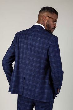 A blue and tan combination is a force to be reckoned with, and this Chigwell blazer is no exception. Featuring a timeless woven check in varying shades of blue and contrasting tan buttons, it makes for the perfect choice for your next formal event. Cut to a slim fit, it defines the torso to create a flattering silhouette and with a complimentary pocket square you'll always look presentable. Model wears size 38R. Features Slim fit Fully lined Single-breasted Peak lapel Single back vent Four butto Blue Tweed Jacket For Business Casual, Tweed Blazer With Double Button For Business Casual, Blue Tweed Jacket For Semi-formal Occasions, Semi-formal Blue Tweed Jacket, Blue Tweed Jacket With Welt Pockets For Office, Blue Tweed Suit With Notch Lapel, Blue Tweed Suits With Notch Lapel, Blue Tweed Jacket With Notch Lapel, Business Plaid Tweed Blazer