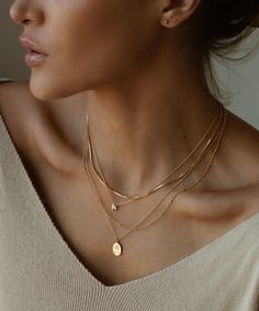 This necklace is EVERYTHING. The charm is solid 14k yellow gold. The chain is available in 14k gold filled (for a more budget friendly option) or in solid 14k gold. The naked eye cannot see the difference between the solid 14k gold or 14k gold filled chain. Dainty Necklace Stack, Mia Necklace, St Christopher Necklace, Gold Layered Necklace, Popular Necklaces, St Christopher Pendant, Box Chain Necklace, Saint Christopher, Dainty Chain