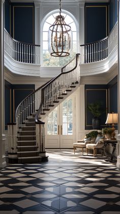 an elegant foyer with stairs and chandelier