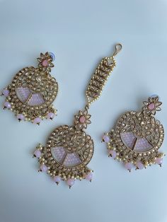 Gorgeous polki tikka sets that come in two beautiful shades of Pink and champagne gold to really pop any outfit for an event! These come as a pair with earrings and the headpiece tikka together! Pink Stone Work Tikka As Gift, Pink Chandbali Tikka As Gift, Bollywood Style Pink Tikka With Stone Work, Pink Stone Work Tikka For Festive Occasions, Pink Stone Work Tikka For Party, Pink Stone Work Tikka For Festivals, Pink Stone Work Tikka For Diwali, Pink Tikka With Stone Work For Diwali, Pink Tikka With Latkans For Festivals