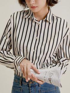 This is a feminine and romantic shirt by LANGSON that is made out of high quality polyester 100% fabric. With design detail of relaxed silhouette and stripe pattern overall, it gives a trendy and feminine look. - Relaxed silhouette- Vertical stripe pattern - Feminine and modern mood Chic Shirt With Striped Collar And Relaxed Fit, Chic White Shirt With Vertical Stripes, Chic Relaxed Fit Shirt With Striped Collar, Chic Striped Relaxed Fit Shirt, Chic Vertical Stripes Office Blouse, Chic Vertical Stripes Blouse For Spring, Chic Vertical Stripes Office Shirt, Chic Vertical Stripes Shirt For Spring, Chic Spring Shirt With Vertical Stripes