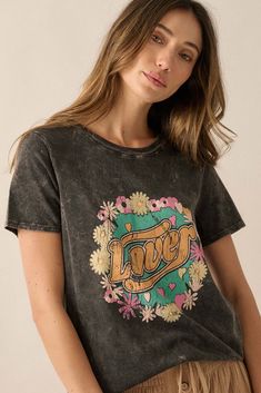 Mineral washed graphic t-shirt. Vintage-style "Lover" text print with floral graphics. Round neckline. Short sleeves. Relaxed fit. 100% Cotton. Imported top designed and printed in LA. Model wears size S. Vintage Washed T-shirt For Spring, Retro Washed Black T-shirt For Summer, Spring Graphic Tee Washed Style, Spring Washed Black T-shirt With Letter Print, Trendy Acid Wash Tops With Screen Print, Spring Graphic Tee Washed, Spring Washed Graphic Tee, Vintage Washed Black Top With Letter Print, Acid Wash T-shirt With Screen Print For Spring