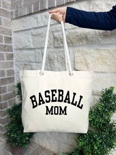 Baseball Mom Gifts, Baseball Mom Tote Bag, Baseball Mom Bag, Gift For Baseball Mom, Baseball Mom Bag, Baseball Team Mom Gift HOW TO ORDER: 1. Please, Check and Review all Photos.  2. Choose Your Quantity as much as you want. 3. Click "Add To Cart". For multiple items go back to the listing and repeat the steps. *DETAILS OF THE BAGS: 25L Tote Bag Measurements - 20"L x 15"H x 5"D 100% cotton , 26" rope handles, inside zippered flap pouch pocket. * PROCESSING & SHIPPING: Processing time is 1-2 days Sporty Letter Print Bags For Sports, Sporty Letter Print Sports Bag, White Letter Print Sports Bag, Sporty Large Capacity Canvas Tote Bag, Sporty White Canvas Tote Bag, Sporty Rectangular Cotton Bag, Sporty Large Capacity Canvas Bag, Sporty Rectangular Canvas Bag, Sporty White Canvas Bag For Daily Use