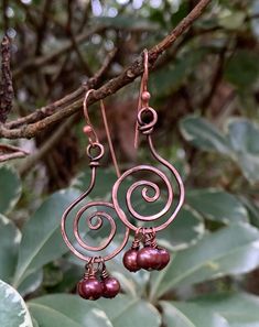 Hammered Copper Circles with Burgundy Pearl Dangles. Lightweight, flirty earrings.Approximately 1 1/2" long and 5/8" wide.These earrings have been antiqued, polished and sealed.Sealed with Protectaclear ProtectaClear is a clear, protective coating that is tough enough to protect jewelry and is safe for wear against skin. ProtectaClear is practically invisible once applied and will seal and protect jewelry from tarnish, oxidation, and corrosion Copper Chandelier Dangle Earrings For Pierced Ears, Pierced Copper Dangle Earrings, Copper Dangle Earrings With Ear Wire, Drilling Glass, Hammered Copper Earrings, Wire Wrap Jewelry Designs, Pearls Earrings, Wire Wrap Jewelry, Earring Designs