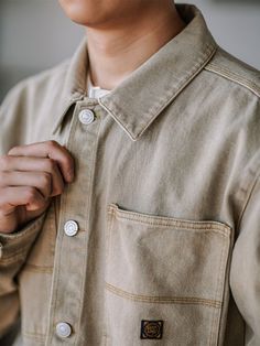 This denim shirt is a year-round essential for your wardrobe. It can be worn alone in the summer or as a layering piece in the colder months. Vintage-inspired work-shirt detailing. Crafted from heavyweight cotton with a straight fit, it is a washed out taupe. FEATURES 100%cotton Straight collar Buttoned placket Two chest pockets. SIZING & FIT Please carefully read the size info before purchase! Different products have different size info.Please use this info as a general guide as measurements ar Shirt Detailing, Denim Overalls Shorts, Chino Jeans, Work Shirt, Parka Coat, Washed Denim, Vintage Coat, Work Shirts, Layering Pieces