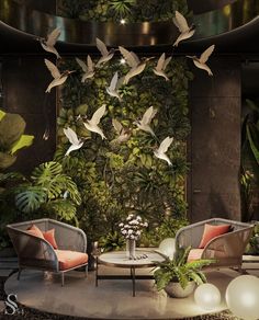 a living room filled with furniture and lots of plants on the wall behind it is a bird sculpture