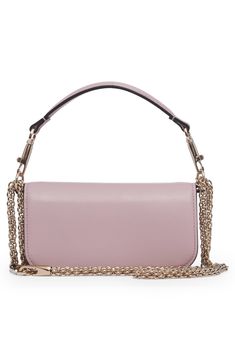 Crafted of smooth calfskin leather, this shoulder bag showcases a '90s-inspired baguette silhouette and crystal-embellished VLOGO hardware. A top handle and pull-through chain strap—both detachable—offer carrying options for the covetable look. Magnetic-snap flap closure Removable top carry handle; removable pull-through chain strap Interior wall pocket Leather lining Leather Made in Italy Designer Handbags Formal Leather Baguette Bag With Chain Strap, Luxury Soft Leather Baguette Bag For Evening, Luxury Leather Baguette Bag With Chain Strap, Formal Pink Leather Baguette Bag, Evening Baguette Bag With Silver-tone Hardware, Luxury Lavender Shoulder Bag For Women, Luxury Lavender Shoulder Bag, Valentino Crystal Bag, Silver Valentino Bag