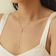 This dainty Y-Lariat necklace hangs on a delicate, diamond-cut cable chain from our signature O Collection. Pair it with other necklaces from this collection. Our patented connectors let you easily link and layer necklaces in any order you desire. Drop Height 3in (7.6cm) Adjustable chain: 17-19in (43-48cm) When layered, chain length is: 17-23in (43-58cm) Learn more Gold Vermeil Spring clasp closure Hypoallergenic, lead and nickel free #322G Cheap Gold Lariat Necklaces, Layer Necklaces, Layer Chain, Gold Lariat Necklace, Minimal Gold, Bff Tattoos, Silver Necklace Set, Layered Chain, Necklace Sets