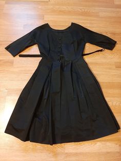 "Mid Century Womens Black Rayon Satin Taffeta Special Occasion Dress Size S Very Good Vintage Condition, No Rips Or Tears, Deodorant Residue Mainly Inside Under Arms. Will Need To Be Cleaned. Dress Has Been Hemmed Up And Could Be Let Down For A More Authentic 40s Length. No Labels Seen Fabric Appears To Be A Rayon Or Silk Satin Taffeta Beautiful Fabric, Not Sure Photos Give Justice Rounded/Boat Neckline 7 Covered Buttons In Front For Decor Closure Is Small Black Snaps And 1 Hook At Waist Raglan Vintage Full Skirt Evening Dress, 1950s Style Black Cocktail Dress, Black 1950s Style Cocktail Dress, 1950s Style A-line Vintage Evening Dress, 1950s A-line Vintage Evening Dress, 1950s Style Black Knee-length Dress, Retro Black Vintage Dress For Evening, Black A-line Vintage Dress For Evening, Black Retro Dress For Vintage Events