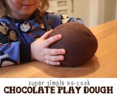 Super Simple No-Cook Chocolate Play Dough 2 cups of all-purpose flour 1/2 cup of table salt 1/2 cup of cocoa 1 1/2 cups of boiling water 3 tablespoons of vegetable oil 1/2 teaspoon of vanilla (optional) Put all ingredients into a large bowl.  Mix well until a ball starts to form.  Let cool for a few minutes and then dump it onto the counter and knead. Play! Chocolate Play Dough Recipe, Chocolate Playdough, Chocolate Play Dough, Chocolate Activities, Cooking Kits For Kids, Cooking Kit, No Cook