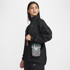 The music pumps, the crowd dances, and the vibes are through the roof. This crossbody bag carries your phone, tickets and camera so there's nothing in your hands to hold you back from your best dance moves. Functional Phone Bag, Functional Black Crossbody Phone Bag, Nike Shoulder Bag For Everyday Use, Black Mobile Phone Shoulder Bag For Streetwear, Black Sporty Shoulder Bag For Streetwear, Functional Shoulder Bag For Streetwear, Black Nylon Phone Bag For Everyday Use, Functional Mobile Phone Bag For Streetwear, Nike Black Shoulder Bag For Travel