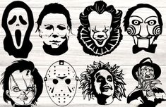 halloween masks with faces drawn on them in black and white, against a wooden background