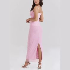 This elegant pink bodycon dress marries the structure and figure-flattering properties of corsetry with the delicate allure of sheer mesh, all while maintaining a light, ethereal aesthetic through its pink color and delicate spaghetti straps. It's a perfect choice for formal events, romantic evenings, or any occasion where making a stylish, impactful appearance is desired. Styling Tip:Heeled sandals or pumps in neutral colors like nude, white, or light pink can elongate the legs and complement t Pink Corset Dress With Sweetheart Neckline For Summer, Pink Corset Dress For Summer Date Night, Fitted Pink Corset Dress For Summer, Chic Pink Corset Dress For Summer, Pink Corset Dress With Sweetheart Neckline For Date Night, Spring Corset Dress With Sheer Bodice, Pink Strapless Chic Corset Dress, Pink Sleeveless Corset Dress For Date Night, Elegant Sheer Corset Dress For Date Night