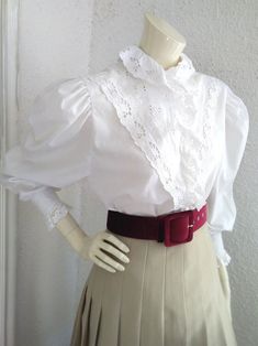 80s folk blouse, austrian tyrolean blouse, embroidered ruffled blouse, plastron lace blouse, edwardian victorian style, puffy sleeve, trachten top, probably the fabric is cotton and polyester. measurements laying flat : shoulders :39 cm (15,5 inches) bust :53cm (21inches) total lenght :67 cm (26,5 inches) sleeve lenght :68 cm (27 inches) Fitted Summer Blouse With Doll Collar, Summer Fitted Blouse With Doll Collar, Victorian Cotton Fitted Blouse, Victorian Fitted Ruffled Blouse, Victorian Fitted Ruffle Blouse, Fitted Victorian Cotton Blouse, Fitted Victorian Blouse With Ruffles, Fitted Tops With Doll Collar For Spring, Spring Fitted Top With Doll Collar