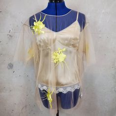 Brand New With Tags Never Worn. Helmet Lang Embroidered 2 Piece Blouse Yellow Embroidery Size Small. Sheer Mesh Top With Neutral Lace Cami Underneath. Cami Has Adjustable Straps. Can Wear Together Or Separate. Cami Is A Size Small. Small Hole In Mesh. (Shown In Photo). Can't See It When Being Worn. No Returns. Spring Embroidered Gold Top, Summer Embroidered Gold Tops, Embroidered Gold Top For Spring, Yellow Top For Spring Wedding, Gold Embroidered Summer Tops, Embroidered Gold Tops For Summer, Gold Embroidered Top For Spring, Yellow Spring Wedding Top, Yellow Silk Summer Tops