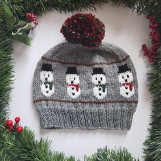 a knitted hat with snowmen on it