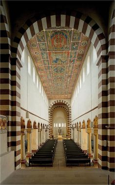 the inside of a church with rows of pews