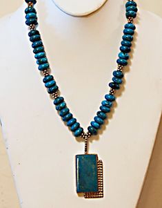 Spectacular Handmade Statement Necklace of Top quality Turquoise Rondelles and Bali Sterling Silver (does not tarnish)This Turquoise Pendant has a Contemporary feel with a Shadow effect of Nailhead Trim in Silver .It measures 2.5" log x 1.25" wide. The Turquoise Necklace is bright Blue and length: 22" with easy to wear Sterling Silver  "S" shaped Clasp.  FREE SHIPPING WITHIN THE USA Artisan Turquoise Rectangular Jewelry, Handmade Rectangular Turquoise Necklace, Artisan Turquoise Necklace With Rectangular Pendant, Artisan Blue Rectangular Necklace, Rectangular Turquoise Gemstone Necklaces, Rectangular Turquoise Gemstone Necklace, Bohemian Turquoise Rectangular Necklace, Artisan Blue Rectangular Jewelry, Rectangular Turquoise Jewelry With Natural Stones