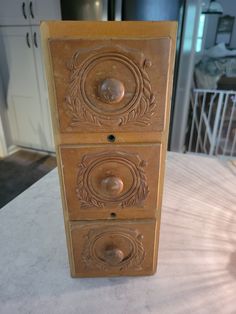 an old wooden cabinet with metal knobs on it