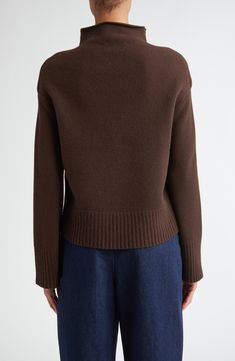 This softly felted wool-blend sweater enhanced with cashmere is knit in a boxy shape with a wide funnel neck and angled fashioning detailing the sides. 21 1/2" length (size Medium) Funnel neck Long sleeves Dropped shoulders Ribbed cuffs and hem 79% wool, 19% cashmere, 1% polyamide, 1% elastane Dry clean Made in Italy Designer Clothing Designer Cashmere Sweater For Fall, Luxury Brown Wool Sweater, Designer Wool Sweater For Fall, Designer Brown Sweater For Winter, Designer Brown Wool Sweater, Designer Merino Wool Sweater For Fall, Designer Wool Sweater With Ribbed Collar, Designer Fine Knit Sweater For Fall, Designer Brown Sweater For Fall