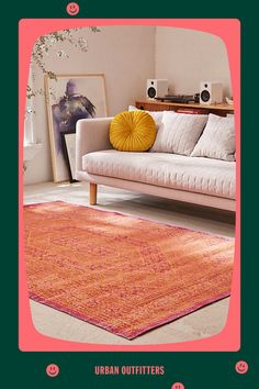 an orange and pink rug in a living room