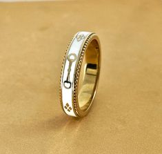 A slim stackable version of our Equus Enamel Ring. Beautiful combination of white enamel and 18 karat yellow gold. 4mm wide Equus (Latin for horse) Cheval (French for horse), stars and a snaffle bit in a continual pattern. Fine beaded detail on both edges. Absolutely gorgeous stacked with the Slim Lace Rein & Diamond Stack rings! Create your own combination! Hand made in the US Made to order, please allow 4-6 weeks for delivery. Snaffle Bit, Stack Rings, Diamond Stacks, Enamel Ring, White Ring, White Enamel, Stacking Rings, Rings For Men, Silver Rings