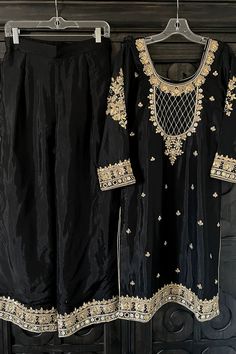 This elegant Black Silk Hand Embroidered Palazzo Suit Set showcases delicate gotta patti, pearl and sequin handwork on the kameez, with intricate embroidery on the palazzo and chinon silk dupatta. The gold border lace on dupatta adds a touch of luxury to this stylish and comfortable ensemble, making it a must-have for any wardrobe. Silk Black Chinon Silk Dupatta 2.5 meter Lined Hand Embroidered String tie back with zipper Full elastic waist band with hook Work: Handcrafted gotta patti work, sequ Phulkari Pants, Lucknowi Kurta, Patiala Salwar Suits, Phulkari Dupatta, Chikankari Suits, Patiala Suit, Bridal Dupatta, Palazzo Suit, Kurta Dress