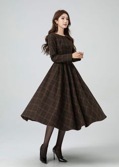 This garment blends timeless elegance with contemporary flair. The cinched waist and flared shape accentuates the waist, and there are pleated details at the waist. The plaid design adds a touch of vintage and sophistication.A must-have for this autumn and winter. DETAIL * 30% wool, 30% fiber, 40% polyester * fully satiny lining, more nice to the touch body * Boat neckline * Long sleeves dress * Two side seam pockets * Back zipper closure * Fit and flare dress * Midi wool dress * Plaid wool dres Warm Winter Dress, Winter A-line Pleated Maxi Dress, Elegant A-line Winter Maxi Dress, Fall Pleated Dresses With Full Skirt, Formal Full Skirt Dresses For Fall, Fall Dress With Pleated Waist And Full Skirt, Pleated A-line Maxi Dress For Fall, Elegant Fall Midi Dress With Pleated Waist, Chic Pleated Waist Midi Dress For Fall