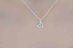 This is a beautiful Sterling Silver Birthstone Heart March Aquamarine Crystal Necklace. Both the charm and the chain are made from sterling silver. :) Measurement of charm in mm: Height: 14 Width: 9 Thickness: 1 (height includes jump ring) Measurement of necklace length in Inches: You will be able to select a 16, 18, or 20 inch chain. There are two types of chains, the regular chain or an upgraded chain option. Check out the last two pictures to see which chain you like best. Add a Swarovski Bir Sterling Silver Heart Birthstone Necklace, Silver Birthstone Necklace With Heart Charm, Sterling Silver Heart Charm Birthstone Necklace, Open Heart Birthstone Charm Necklace, Sterling Silver Open Heart Birthstone Necklace, Sterling Silver Birthstone Necklace With Heart Charm And Pendant, Sterling Silver Birthstone Necklace With Heart Pendant And Charm, Sterling Silver Heart Pendant Birthstone Necklace, Sterling Silver Birthstone Necklace With Heart Pendant