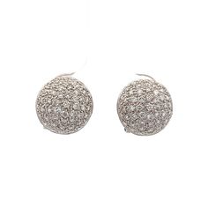 1.10 Ct Domed Pave Diamond Earrings in 18k White Gold These earrings feature a dome shape adorned with round brilliant cut diamonds, with a total weight of 1.10 carats. The diamonds possess VS2 clarity and H color, ensuring a clear and bright appearance. Set in 18 karat white gold, the polished finish enhances the overall sparkle of the diamonds. The pave setting style adds depth and dimension to the design, making these earrings a versatile addition to any jewelry selection. The earrings are secured with stud backs, providing both comfort and security for daily wear. PRIMARY STONE Stone: Natural Diamond Shape: Round Diamond Color: H Clarity: VS2 Weight: 1.10 ct Measurements: 1.25 mm = .01 ct (110) CHARACTERISTICS Measurements: 12.5 mm Era: Modern Composition: 18 Karat White Gold Total Dia Formal White Cluster Earrings With Single Cut Diamonds, Formal Round Platinum Cluster Earrings, Diamond White Diamond Earrings With Pave Setting For Formal, Luxury Round Diamond White Earrings, Classic Round Cluster Earrings In Platinum, Classic Round Platinum Cluster Earrings, Formal Round Cubic Zirconia Diamond Earrings, Diamond White Round Cluster Earrings For Formal Events, Luxury Round Diamond Earrings