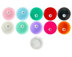 six different colors of plastic discs on a white background