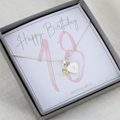 Sterling silver 18th birthday birthstone necklace, makes the perfect gift to mark this special milestone birthday. The necklace is displayed on a pretty 18th birthday presentation card.  It is tucked inside a luxurious Georgia & Grace jewellery box and secured with a hand tied ribbon. If required a handwritten gift card will be tucked under the bow, ready for gifting. Choose either her birthstone or favourite colour from the birthstone chart, this can be purchased with or without a heart initial Silver Birthstone Necklace For Birthday And Mother's Day, Silver Birthstone Necklace For Birthday, Silver Birthstone Necklace For May Birthdays, Silver May Birthstone Necklace For Birthday, Silver May Birthstone Necklace As A Gift For Her, Silver Birthday Necklaces With May Birthstone, Silver Necklace For Birthday With May Birthstone, Silver Necklace With May Birthstone For Birthday, Silver Charm Necklaces For Birthday