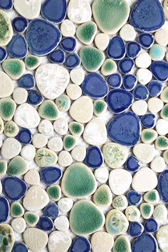 blue and white rocks are arranged in a mosaic pattern