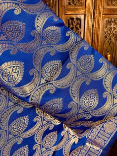 Gorgeous Royal Blue Soft Banarasi Dupatta with muted gold Zari Work. Dupatta is Soft and will add beauty to any Outfit. Please note - The Floral Jaal design might look Sliver zari work however its not sliver its muted gold. Item: DupattaColor : Royal Blue Fabric : Banarasi Silk (Not Pure Silk)Work : Zari Weaved with tassels Size : Full Size DupattaLength of the Dupatta : 92 inches approx.Width of the dupatta : 35 1/2 inches (Approx.)Store Policies- No return or exchange will be accepted for colo Royal Saree With Zari Work, Royal Gold Traditional Wear With Zari Work, Royal Gold Traditional Wear With Traditional Drape, Royal Traditional Wear With Pallu For Festive Season, Royal Gold Traditional Wear For Festive Season, Royal Dupatta With Traditional Drape And Pallu, Royal Dupatta With Pallu In Traditional Drape, Blue Jamawar Blouse Piece For Wedding, Wedding Blue Jamawar Blouse Piece