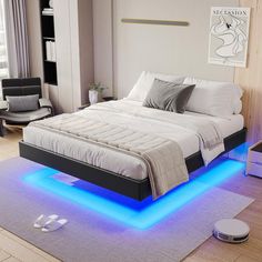 a bed with blue lights underneath it in the middle of a living room next to a window