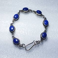 Lapis lazuli 925 Sterling Silver Gemstone Adjustable Bracelet Oval Shape Jewelry Adjustable Bracelet Lapis lazuli Bracelet For Women Jewellery Silver Bracelet Sterling Silver, Silver Charm Jeweler Wedding Glam Gemstone name- LAPIS LAZULI                              Colour-                    as shown as a picture Shape-                    OVAL Stone Size-             9×7×4 MM                                                                                 Bracelet length-    7.50 inches Bracelet width-      2.00  inche Bracelet Weight  -  15.80 gram                                   (79.00 cts ) approx Quality-                   AAA   Quantity-                1 BRACELET **images are taken in natural Bright sunlight and Low light. you will get same flash in same conditions. These are Gemsto Wedding Glam, Lapis Lazuli Bracelet, Women Jewellery, Hippie Bracelets, Jewelry Bracelets Silver, Jewellery Silver, Handmade Fashion Jewelry, How To Make Necklaces, Bracelet Argent