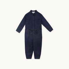 Kick off the winter season in style with this classic Denim Jumpsuit. This heavy denim jumpsuit in deep indigo features twin pockets on the chest, side pockets and back pockets and a waist tie. Style it layered over a tee with TTBS socks and your favourite trainers for the perfect autumnal look.  Made in Portugal.Measurements for size 36:Top length: 48,5cm. 
Pant length: 91cm. 
Chest width: 50cm. 
Waist width: 47cm. Denim Belted Overalls Jumpsuits And Rompers, Casual Denim Jumpsuit With Patch Pockets And Relaxed Fit, Casual Relaxed Fit Denim Jumpsuit With Patch Pockets, Casual Denim Jumpsuit With Belt Loops, Belted Denim Jumpsuit For Workwear, Utility Cotton Denim Jumpsuit With Belt Loops, Utility Style Cotton Denim Jumpsuit With Belt Loops, Casual Denim Belted Jumpsuits And Rompers, Utility Overalls With Patch Pockets For Work