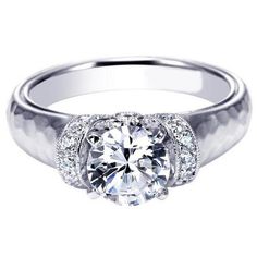 a white gold engagement ring with diamonds on it