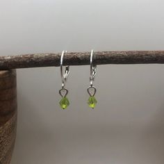 Lime green acrylic bicone bead earrings with silver plated sleeper style hoop. Super light weight feel Green Teardrop Nickel-free Hoop Earrings, Nickel-free Green Teardrop Hoop Earrings, Green Teardrop Nickel Free Hoop Earrings, Adjustable Green Hoop Earrings, Green Teardrop Hoop Earrings For Jewelry Making, Green Dangle Hoop Earrings Hypoallergenic, Green Sterling Silver Hoop Earrings For May Birthstone, Green Hypoallergenic Hoop Earrings For May Birthstone, Hypoallergenic Green Hoop Earrings For May Birthstone