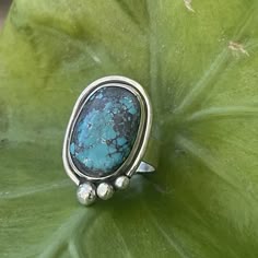 Gorgeous hubei turquoise ring handcrafted in sterling silver. Size is 7.25 This ring was created with a gorgeous piece of authentic oval turquoise, bezel set in sterling silver, accented with a wire cradle and 3 sterling balls, set on a sterling silver 1/4 inch hand stamped band! Perfect boho accessory for everyday wear. Handcrafted in my studio with love. Oval Turquoise Ring, Handmade Bohemian Turquoise Ring In Sterling Silver, Handmade Bohemian Turquoise Sterling Silver Ring, Bohemian Sterling Silver Turquoise Ring, Sterling Silver Patina Ring, Bohemian Untreated Sterling Silver Ring, Bohemian Sterling Silver Turquoise Ring Nickel Free, Unique Handmade Turquoise Sterling Silver Ring, Handmade Unique Turquoise Sterling Silver Ring