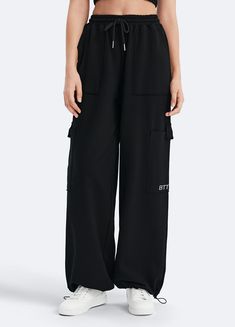 Embrace roomy wide legs and a stretchy fit for ultimate comfort, paired with a flattering high waist for added style. Whether it's grocery runs, lazy Sundays, or a casual hangout, these joggers have you covered in relaxed elegance. Relaxed Fit Wide Leg Sweatpants With Cargo Pockets, Relaxed Fit Wide Leg Lounge Pants With Cargo Pockets, Casual Wide Leg Pants With Cargo Pockets For Loungewear, Casual Wide Leg Cargo Pants For Loungewear, Comfortable Wide Leg Sweatpants For Elevated Casual Wear, Relaxed Fit Full-length Parachute Pants For Loungewear, Comfortable Black Wide-leg Pants, Black Drawstring Wide-leg Pants, Black Wide-leg Drawstring Bottoms