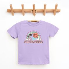 Looking for a cute tee for your kids? We have the perfect Sunkissed Rainbow graphic tee addition to their closet! Also available in toddler tees. Nintendo Princess, Trending Graphic Tees, Rainbow Graphic, Dark Lavender, Bow Shorts, Minnie Mouse Girl, Girls Rules, Top Graphic Tees, Kids Outfits Girls