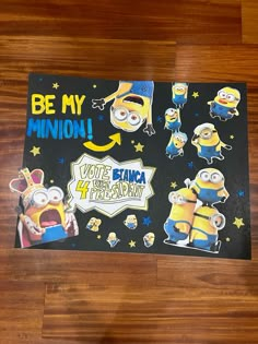 there is a poster on the floor that says be my minion with some minions