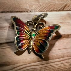 Beautiful signed Beau B Sterling charm/pendant.  Vibrant greens, reds and orange colors make this butterfly stand out.  Suitable for a necklace or bracelet. Painted Butterfly, Butterfly Charm, Charm Pendant, Pendant Necklaces, Orange Color, Jewelry Necklace Pendant, Charms, Accessory Gift, Jewelry Necklaces