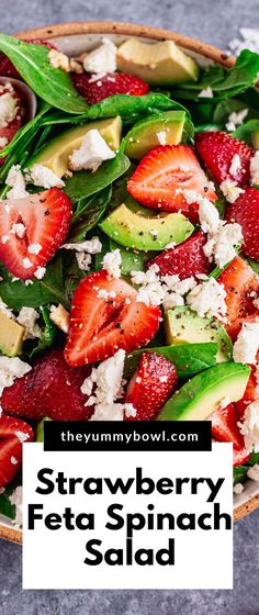 strawberry, avocado and feta spinach salad in a bowl with the title overlay