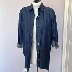 New (W/O Tag) Light Denim Front And Sheer Chiffon Back, Collared And Button Down Shirt. Has Suspended Sleeves Or Buttoned Cuff Sleeve Options. Hand Wash And Hang Dry. Iron Only Denim Material If Necessary. Cheap Denim Blue Button-up Blouse, Relaxed Fit Washed Blue Denim Button-up Top, Washed Blue Button-up Denim Top With Pockets, Denim Blue Snap Button-up Tops, Washed Blue Button-up Shirt With Patch Pockets, Denim Material, Size Label, Sheer Chiffon, Light Denim